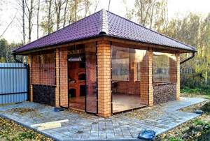 gazebo with barbecue and brick barbecue for the dacha