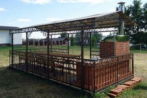 large wrought iron gazebo with barbecue for the cottage
