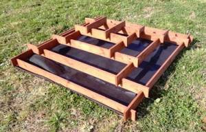Flower bed-pyramid made of boards: original decoration of a garden plot with your own hands