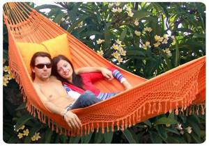 FORRO double orange hanging hammock outdoors, Brazil