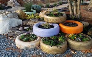 Flowerbed made of tires in a private garden
