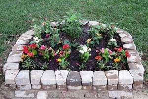 Small flower garden made of paving slabs - photo 1