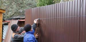 Covering a fence with corrugated sheets