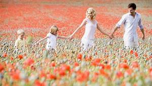 Happy family in poppy field