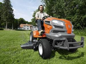 Mowing the lawn with a garden tractor