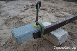 Securing paving stones before cutting with a clamp